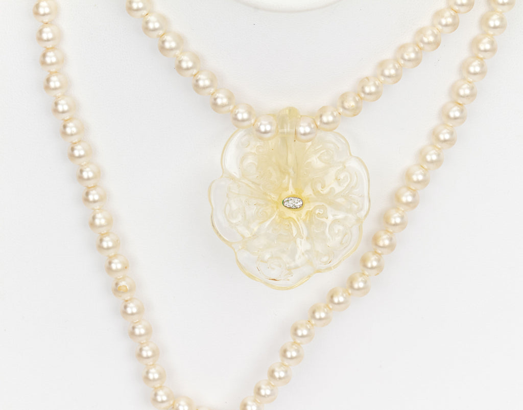Chanel long pearl necklace with camellia